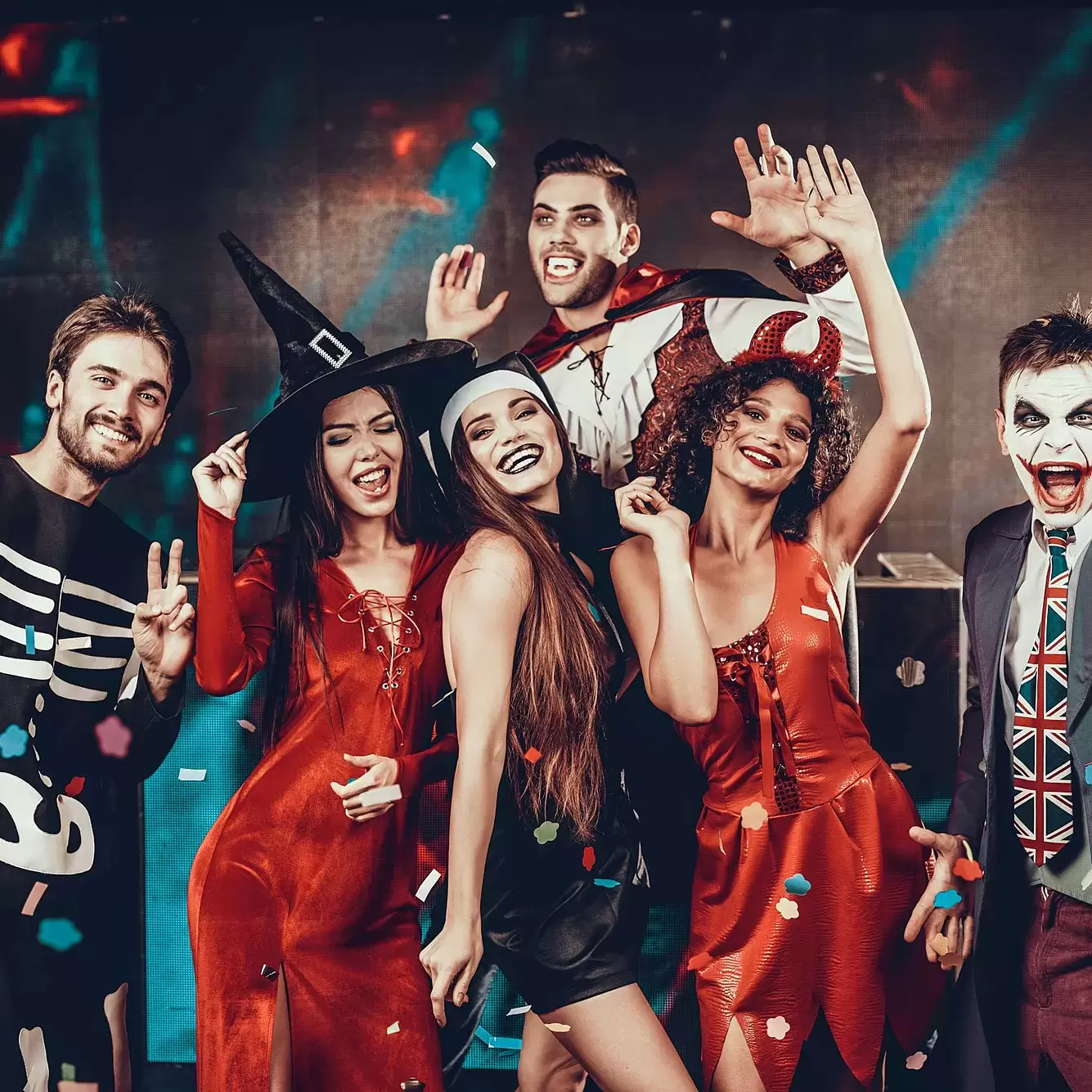 Six adults posing in Halloween costumes.